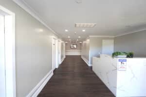 Front desk and a hallway with wooden floors