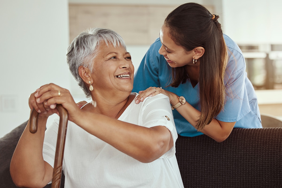 happy nurse and patient talking